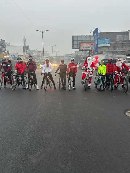 The entire group of riders and Santas lined up on a foggy Christmas morning, ready for the charity ride.