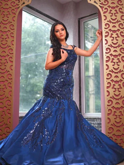 Another full-length shot of the blue fish-cut gown, perfect for a grand entrance.