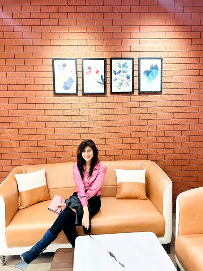 I love seeing my architectural skills come to life. This photo was taken in a space where I particularly enjoyed the combination of the exposed brick wall, the comfortable leather sofa, and the simple artwork.