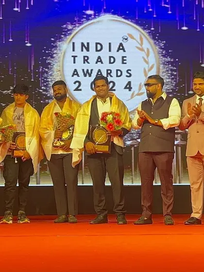 The team being applauded for their collective success at the awards ceremony.