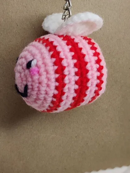 A pink and red striped bee, perfect for Valentine's.