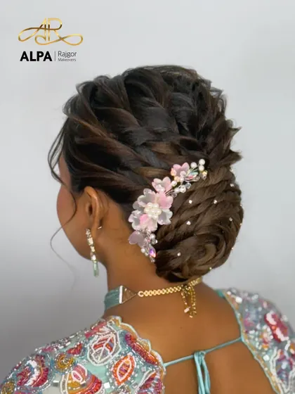 A close-up of the beautiful pink and white floral hairpiece, showing the detailed craftsmanship.