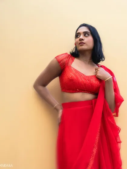 Another look from the Times Fresh Face event. This red lehenga features a shimmering sequin blouse and a simple, flowing skirt, perfect for a party.