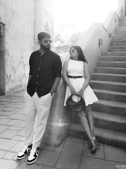 A classic black and white portrait that emphasizes the couple's style and attitude. The high contrast and strong poses give this image a timeless, editorial feel.