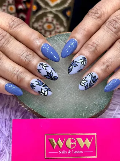 A beautiful floral design on a deep blue base. The hand-painted leaves in shades of blue and white create a sophisticated and artistic look.