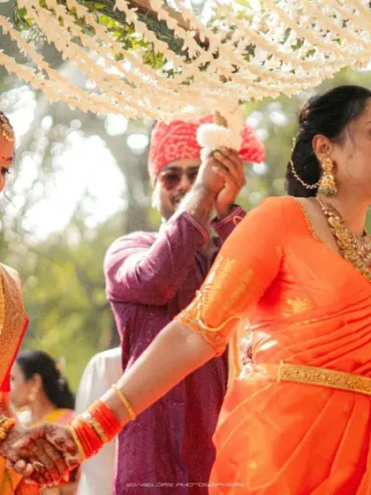 The bride's procession, a moment filled with grace and tradition. I capture the beauty of the bride and the support of her family as she walks towards her future.