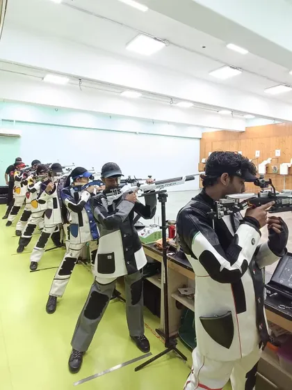 Shooters at our Vashi Centre during a preparation session, showcasing the professional environment and equipment we provide.