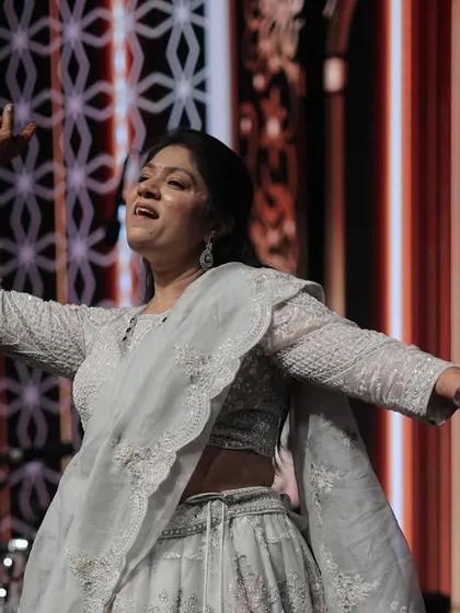 A graceful solo moment during a family member's performance. We ensure everyone gets a chance to shine.