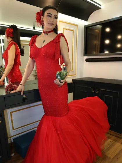 The silhouette of this red gown was simply stunning. The fitted bodice and dramatic fishtail created a powerful and memorable look for the show.