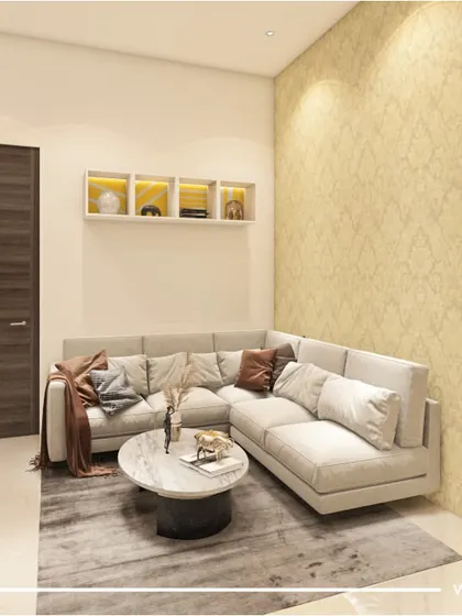 A cozy L-shaped sofa fits perfectly into this living room corner from our 'Majestic Fortune' project. The textured wallpaper and warm wooden doors add depth and a welcoming feel to the space.