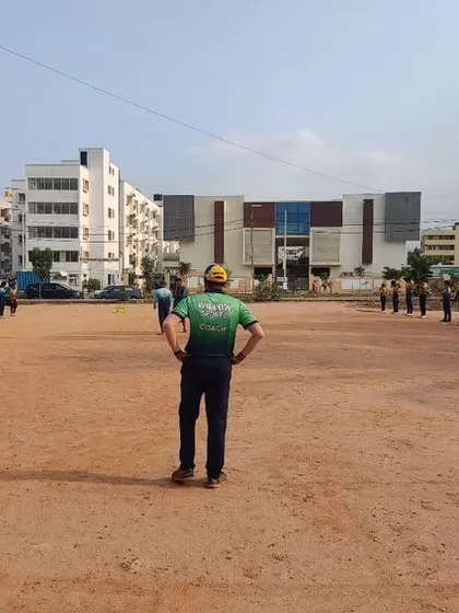 A coach overseeing a fitness session during our summer camp. We believe a strong physical foundation is essential for a long and successful cricket career.
