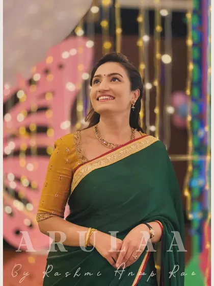 A classic combination for actress Vaishnavi Gowda. I designed this simple yet elegant mustard yellow blouse with a unique neckline to pair with her dark green saree. It's a timeless look perfect for any festive occasion.