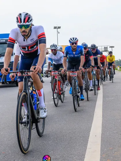 An elite rider, leading the peloton in a long and grueling race.