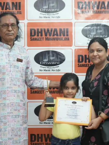 A student with her mother and guru, a picture of family support.