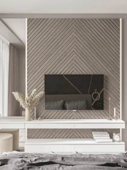 A bedroom design featuring a chevron-patterned wood accent wall that incorporates a vanity table and TV unit for a seamless look.