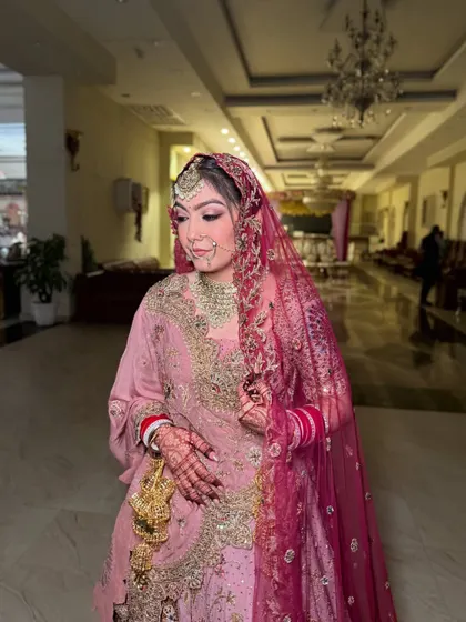 A final shot of the bride, looking poised and ready for her big day. The makeup is set to last through the entire event.