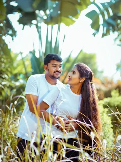 A duplicate of ID 69, this shot captures a loving gaze between a couple in a sun-drenched field, perfect for a casual and natural photoshoot.