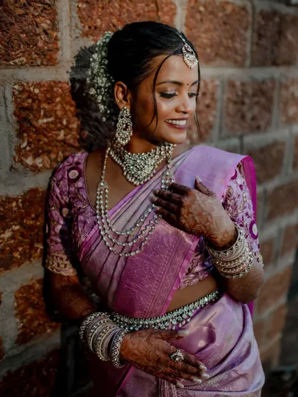 A beautiful bride framed by a traditional doorway. We use architectural elements and natural light to create artistic and striking portraits that highlight her grace.