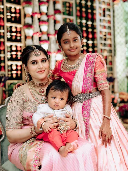 Another lovely shot of me with my children. My daughter's pink and peach half saree was designed to match the tones in my own Kanchipuram silk saree.