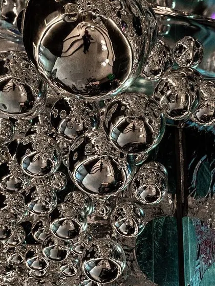 A repeat of image 68, a close-up of the mirrored spheres in the 'Silver Escapade' installation.