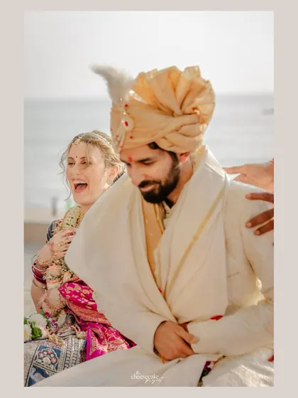 The groom's focused effort and the bride's laughter during the sitting ritual.