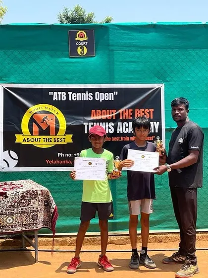 The boys' doubles runners up receiving their trophies from our coach at the ATB Tennis Open.