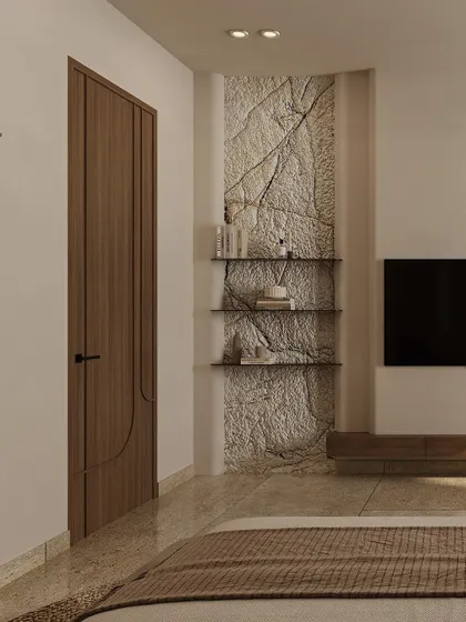 A textured stone feature wall behind the TV serves as a rustic focal point. This raw, natural element is balanced by clean lines and minimalist shelving, creating a perfect blend of warmth and modern function.