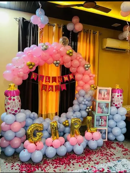Here is a complete welcome home package for a baby girl. It includes a circular balloon arch, 'GIRL' foil letters, 'BABY' blocks, and themed foil balloons, all in a pink and grey color scheme.