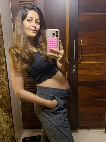 A mirror selfie capturing my baby bump as I entered the third trimester at 28 weeks. It was a busy week of launching a new program and keeping up with fitness.