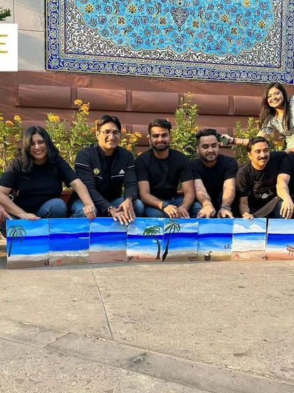 The final masterpiece from our workshop with GoLive. The team stands proudly with their combined beach scene, a perfect representation of their collective effort and creativity.