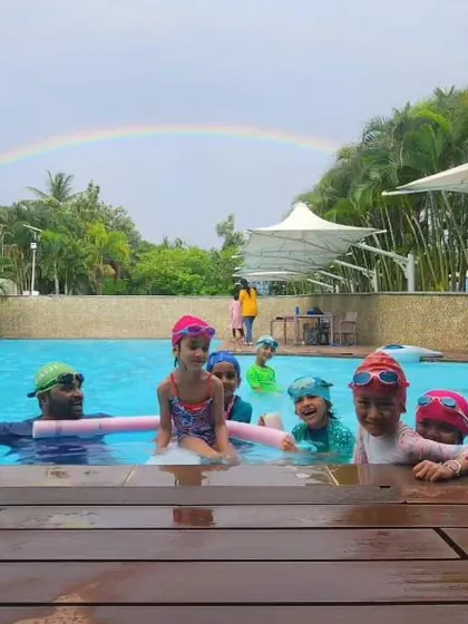 A magical moment at the pool with a rainbow appearing during a kids' swim class. It's moments like these that make learning to swim with us so special.