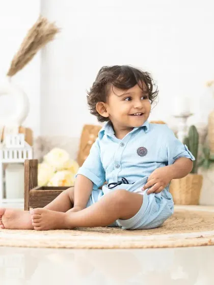 A bright, happy smile from a two-year-old. We know how to engage with toddlers to bring out their best and most natural expressions.