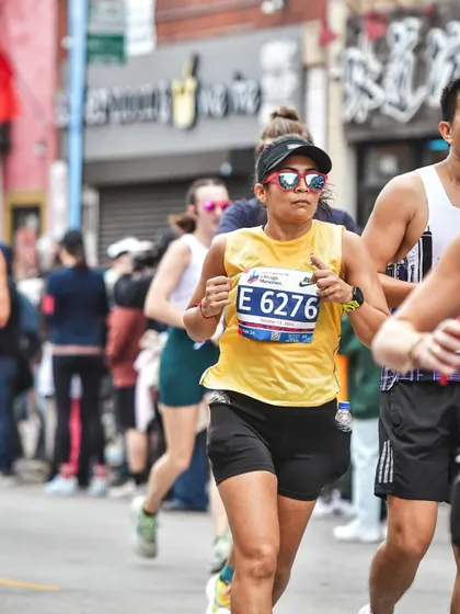 This is the look of pure focus mid-race at the Chicago Marathon. It's not always smiles; it's about digging deep and finding that mental toughness. I coach my runners to push through these challenging moments and stay strong.