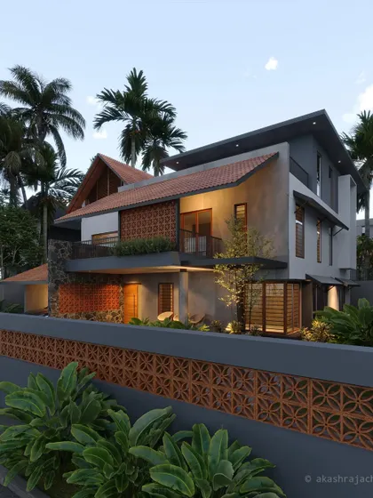 This home features extensive use of terracotta jali screens on both the facade and the boundary wall, paired with stone cladding and sloped roofs.