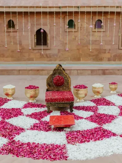 The beautiful setup for the Chooda ceremony, with a checkerboard pattern of red and white rose petals on the floor.