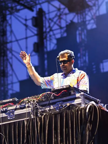 Waving to the thousands of fans during the Harris Jayaraj concert. My performance style is interactive, and I focus on reading and engaging with the crowd to keep the energy levels high throughout the show.