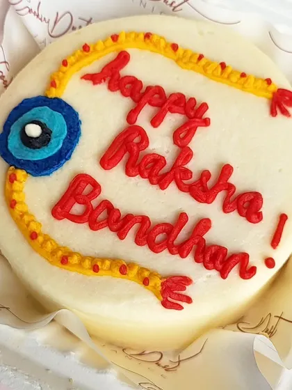 A special bento cake for Raksha Bandhan, featuring a rakhi design piped in buttercream. It's a sweet and personal way to celebrate with your siblings.