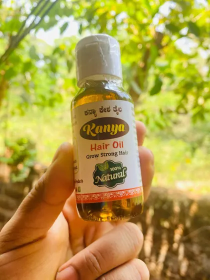 A clear shot of the Kanya Hair Oil bottle. The label is in both English and Kannada to serve my local and national customers.