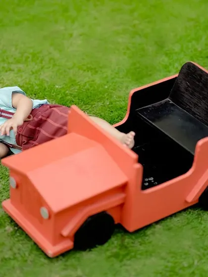 A little boy relaxing by his toy car. We capture those quiet, candid moments in between the playful ones too.