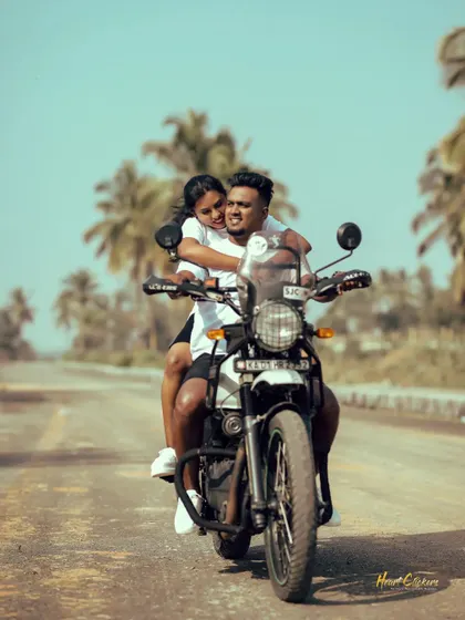 A dynamic shot of a couple enjoying a ride on their Royal Enfield. This captures the thrill and excitement of their journey together.