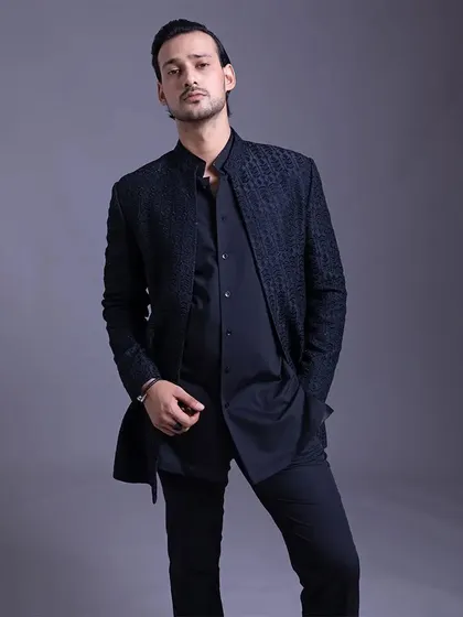 A closer look at the textured jacket, showing how it can be styled for a confident, modern, and detail-oriented look.
