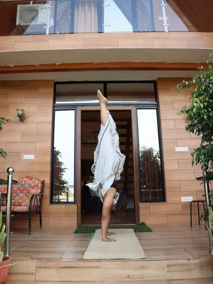 A handstand variation in front of my home, a reminder that practice can happen anywhere.