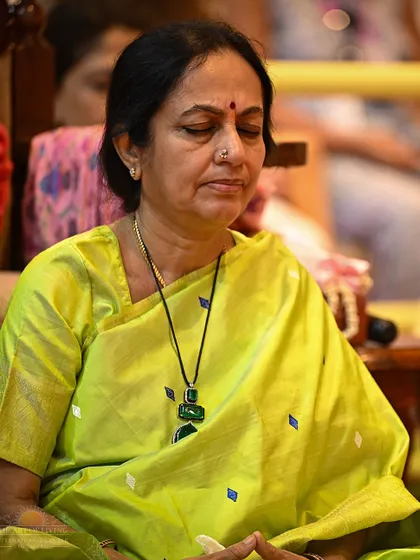 A participant in deep meditation during the Patanjali Yoga Sutras discourse. The sessions are designed to be an experiential journey, where listening to the knowledge itself becomes a meditation.