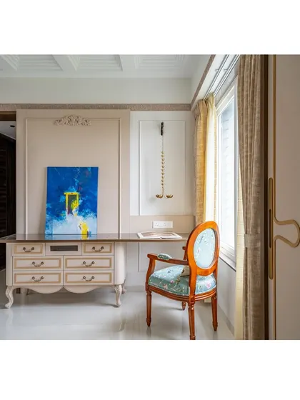 The elegant study area is complemented by a piece of modern abstract art, showing how we love to mix classic and contemporary elements to create a unique, personal space.