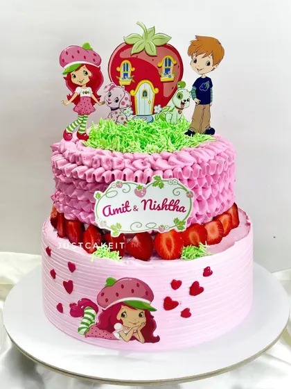 A Strawberry Shortcake-themed cake with a classic, retro piping style. This two-tier cake is a zero-fondant design, perfect for a fresh strawberry cake.