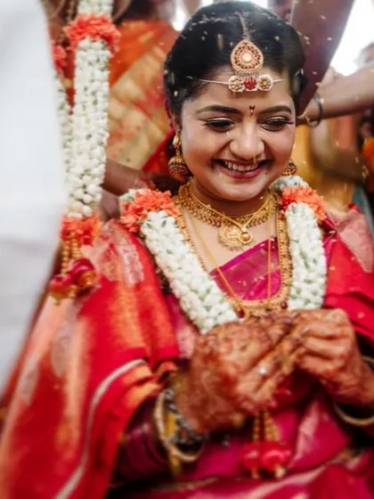 A candid moment of joy during a South Indian wedding ceremony. These unscripted moments of happiness are what make wedding photography so special.