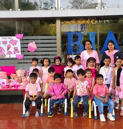 A class photo from Pink Day, with students and teachers all dressed in pink to celebrate the color.