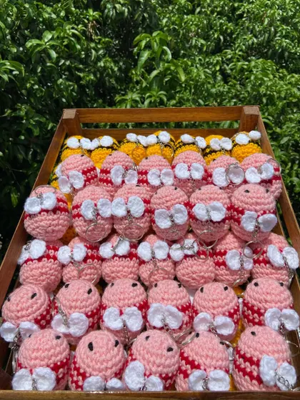 A crate of my adorable bee keychains, handmade with love. This bulk order of 90 pieces includes both classic yellow and cute pink bees.