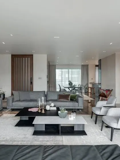 This expansive living room, designed for a young family, is divided into a large social area and an intimate family space. I believe in creating personal sanctuaries that balance timeless design with practical functionality for everyday life.