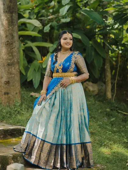 A stunning engagement look for a doctor couple in Mysore. The bride wore a beautiful blue half-saree, and we created a soft, glowing makeup look to complement it.